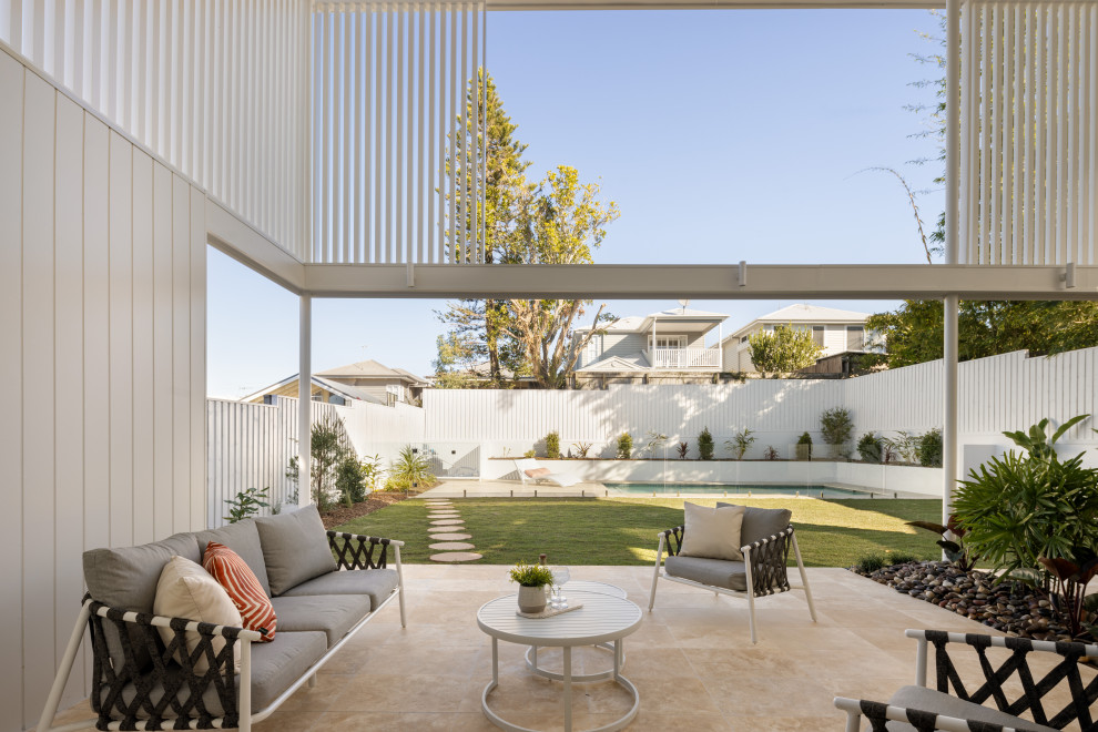 This is an example of a beach style patio in Brisbane.