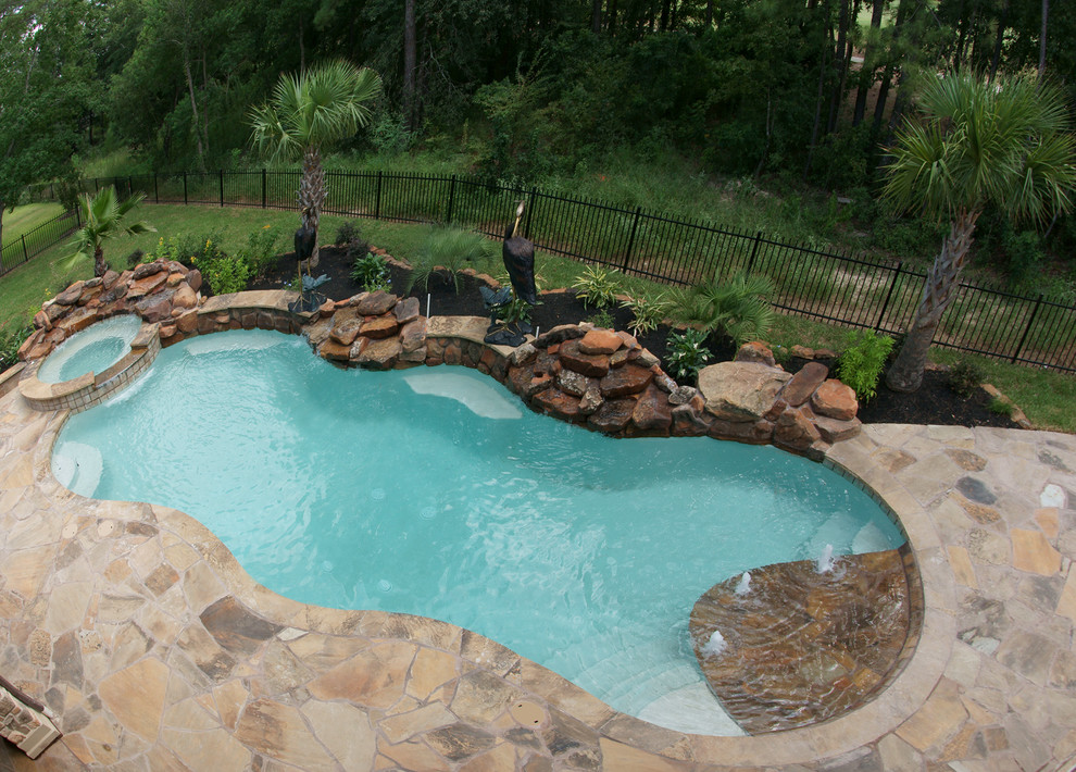 This is an example of a beach style pool in Houston.