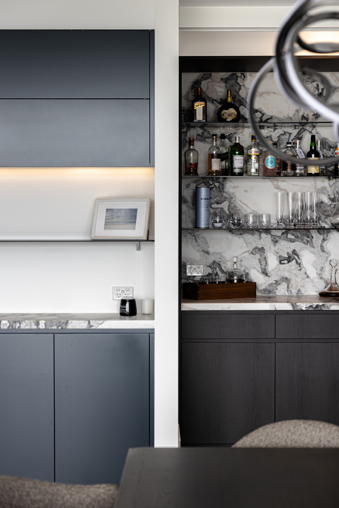 Design ideas for a small contemporary home bar in Other with dark wood cabinets, marble benchtops, multi-coloured splashback, marble splashback, dark hardwood floors, multi-coloured benchtop and open cabinets.