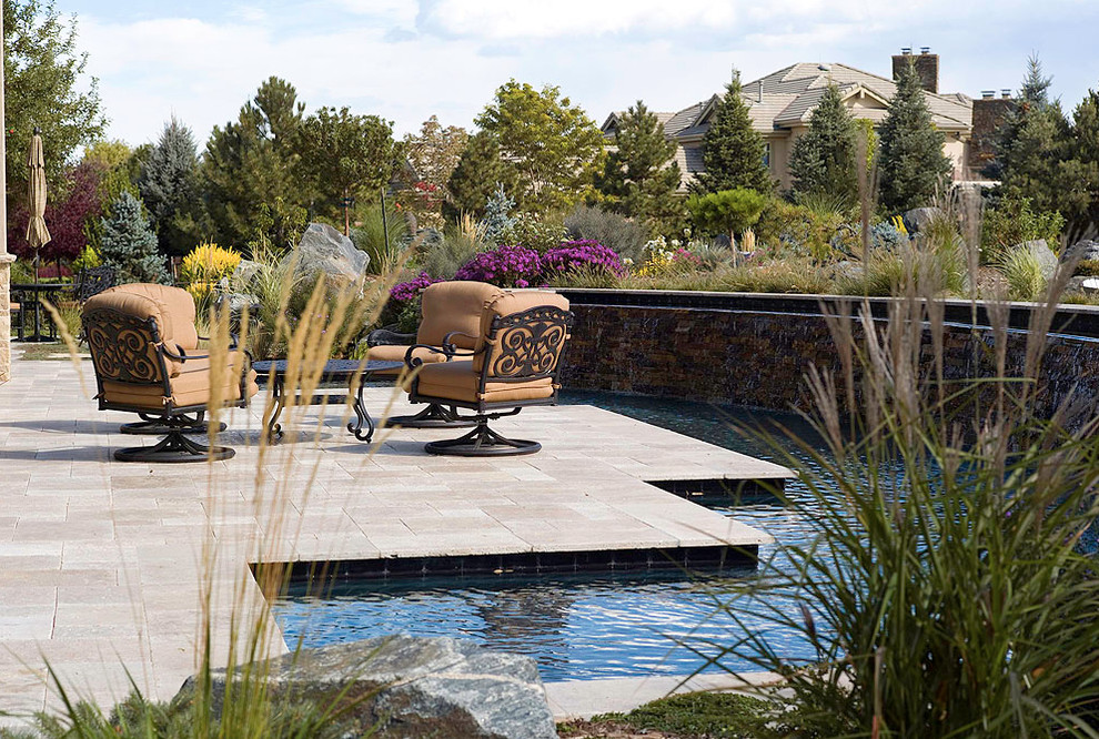 Inspiration for a mid-sized transitional backyard concrete paver patio vertical garden remodel in Denver with no cover