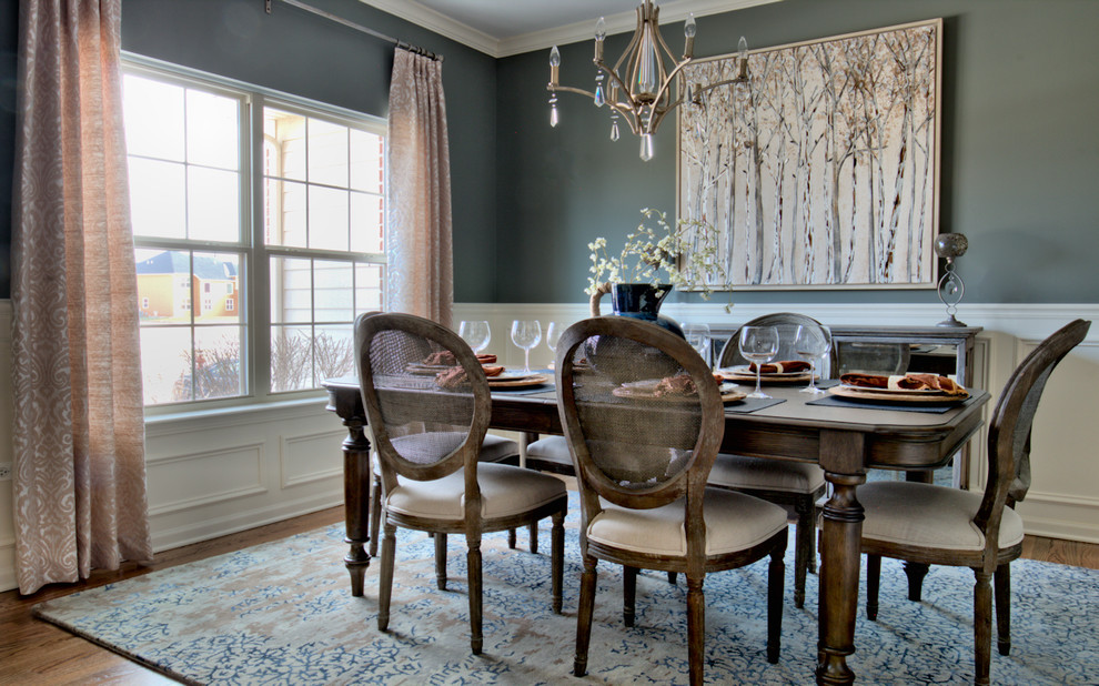 Inspiration for a country separate dining room in Chicago with grey walls and medium hardwood floors.