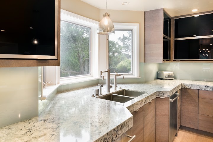 Design ideas for a large eclectic eat-in kitchen in San Francisco with an undermount sink, flat-panel cabinets, light wood cabinets, quartz benchtops and stainless steel appliances.