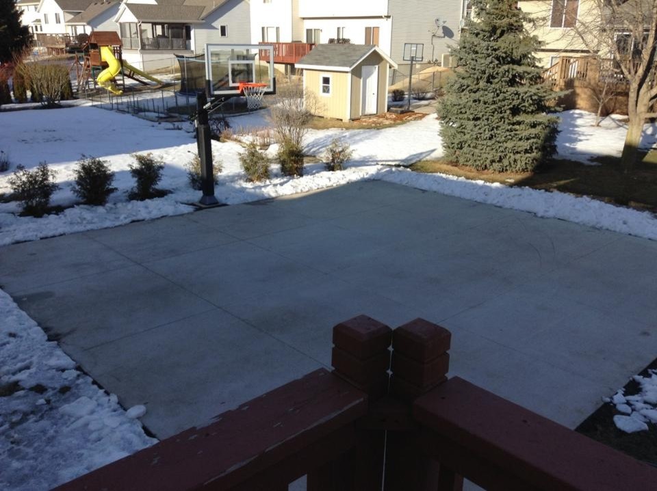 Photo of a large traditional backyard partial sun outdoor sport court in Minneapolis.