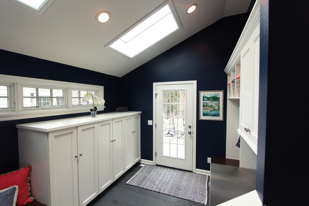 Design ideas for a large transitional mudroom in Other with blue walls, slate floors, a single front door, grey floor and a white front door.