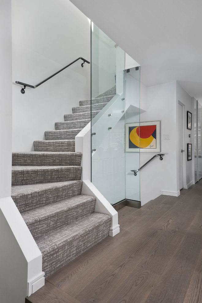 Design ideas for a modern carpeted staircase in Chicago.