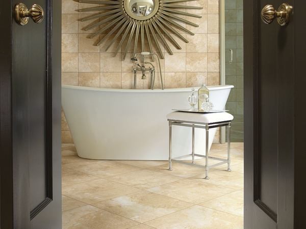 Freestanding bathtub - large transitional master beige tile and stone tile ceramic tile and beige floor freestanding bathtub idea in Toronto with dark wood cabinets, granite countertops, beige walls and a drop-in sink
