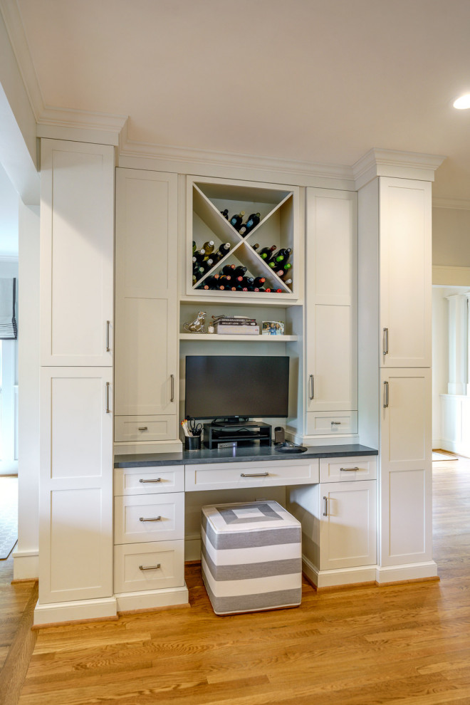Inspiration for a large transitional galley medium tone wood floor and brown floor eat-in kitchen remodel with an undermount sink, shaker cabinets, white cabinets, quartz countertops, white backsplash, marble backsplash, stainless steel appliances, an island and gray countertops