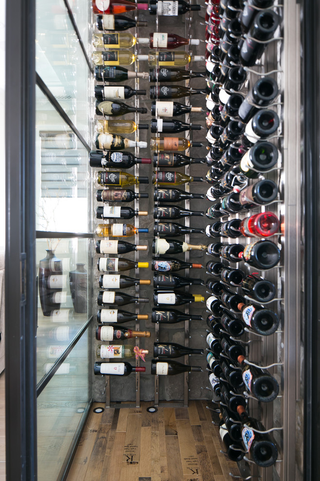 This is an example of a transitional wine cellar in Orange County.