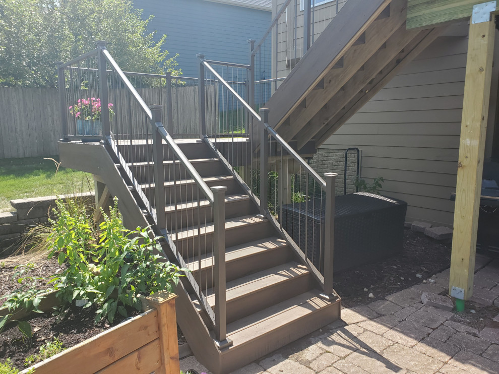 Inspiration for a mid-sized backyard second story cable railing deck remodel with no cover