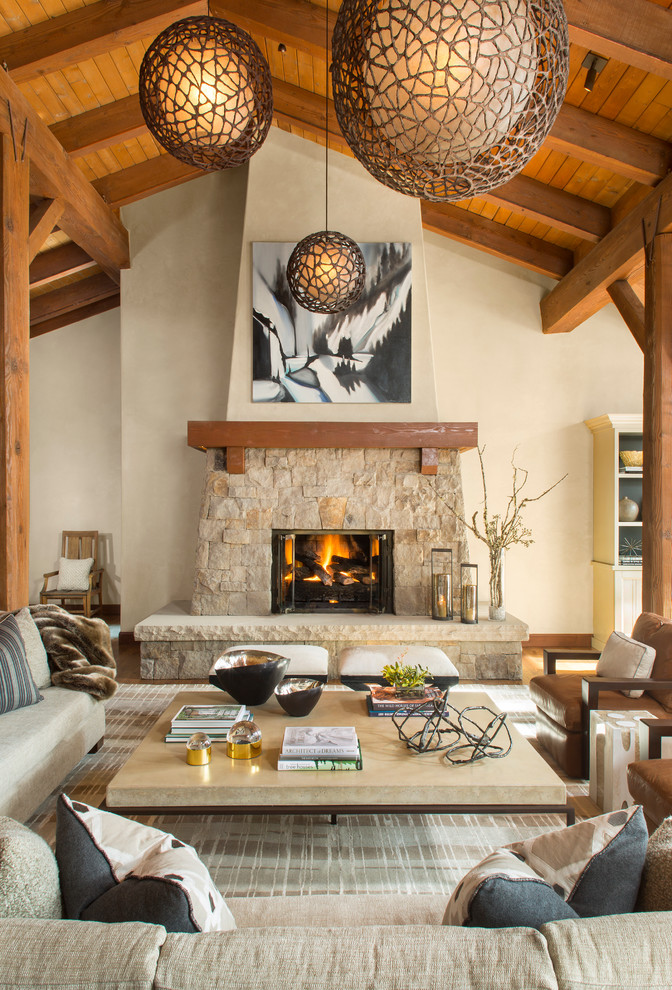 Photo of a transitional formal open concept living room in Denver with beige walls, a standard fireplace and a stone fireplace surround.