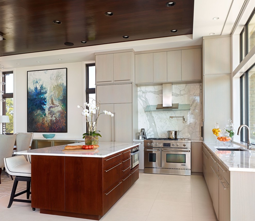 Contemporary l-shaped kitchen in Atlanta with an undermount sink, flat-panel cabinets, grey cabinets, white splashback, stainless steel appliances and with island.