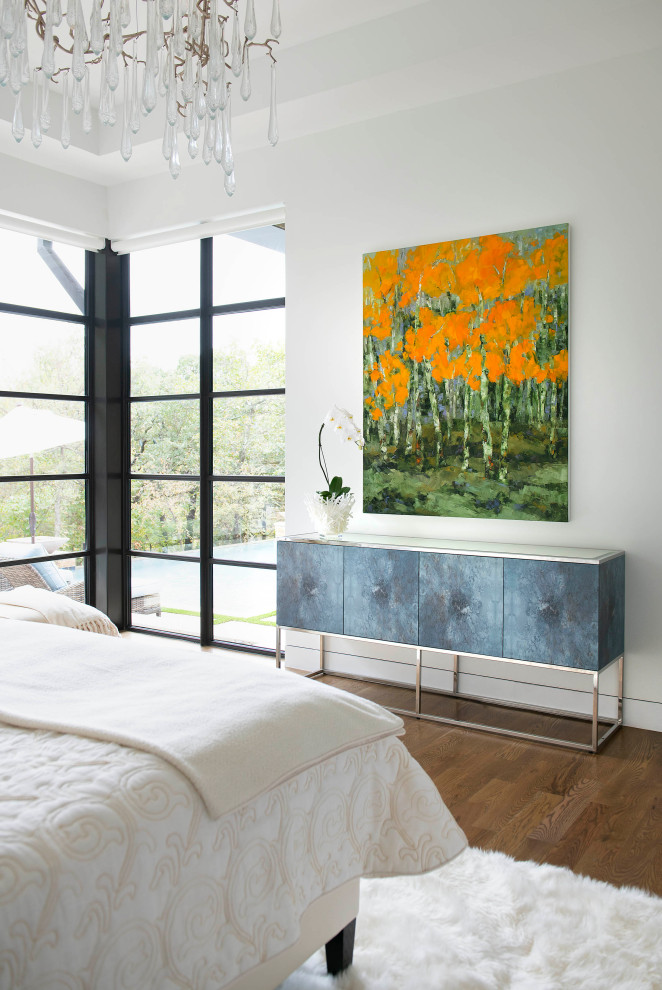 Inspiration for a mid-sized contemporary master bedroom in Dallas with white walls, medium hardwood floors, no fireplace, brown floor and brick walls.