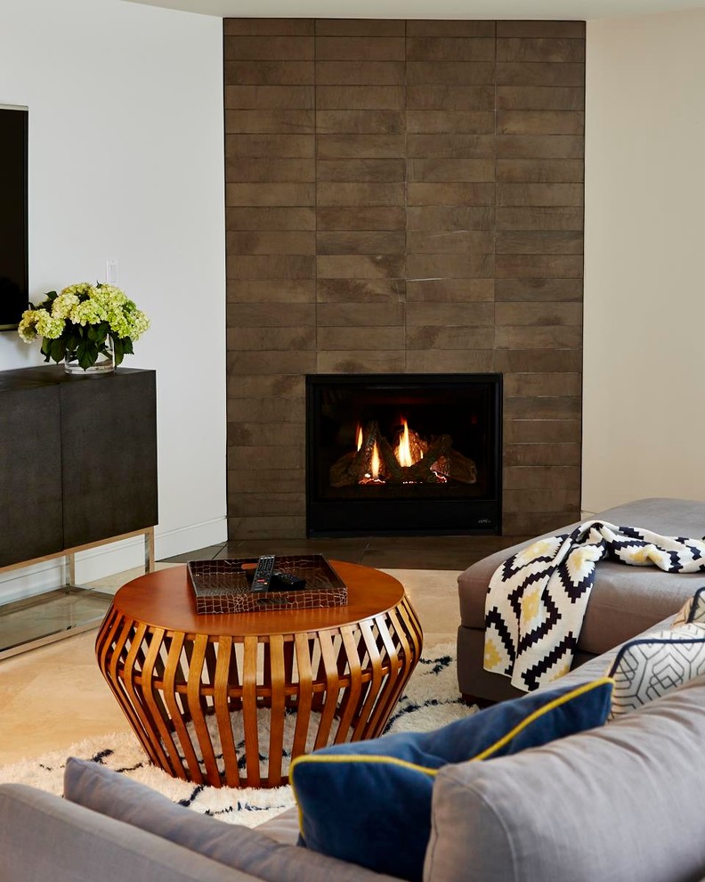 Inspiration for a mid-sized midcentury open concept family room in San Francisco with white walls, travertine floors, a tile fireplace surround and a corner fireplace.
