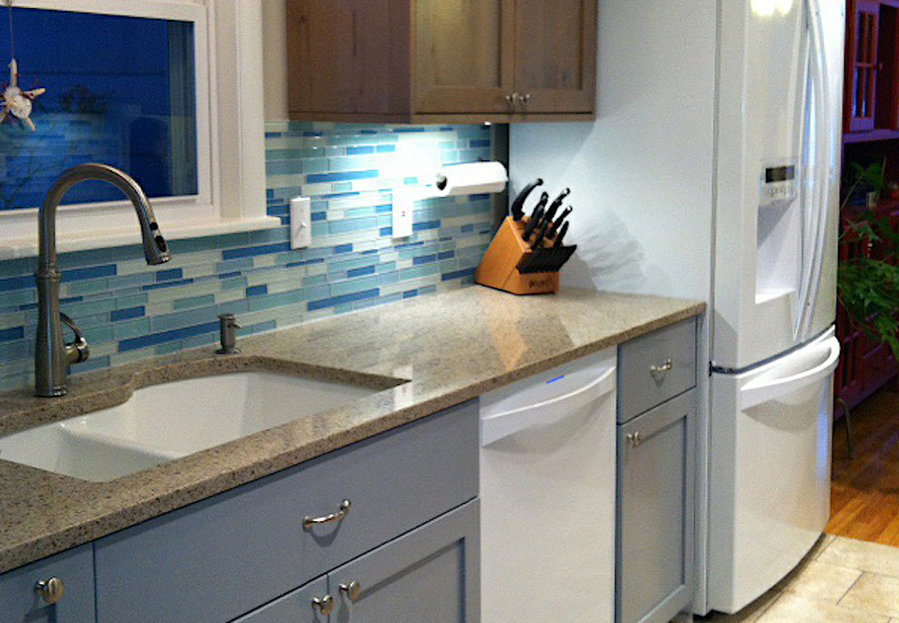 Enclosed kitchen - small transitional galley porcelain tile and beige floor enclosed kitchen idea in Boise with an undermount sink, shaker cabinets, dark wood cabinets, quartz countertops, blue backsplash, matchstick tile backsplash, white appliances, no island and brown countertops