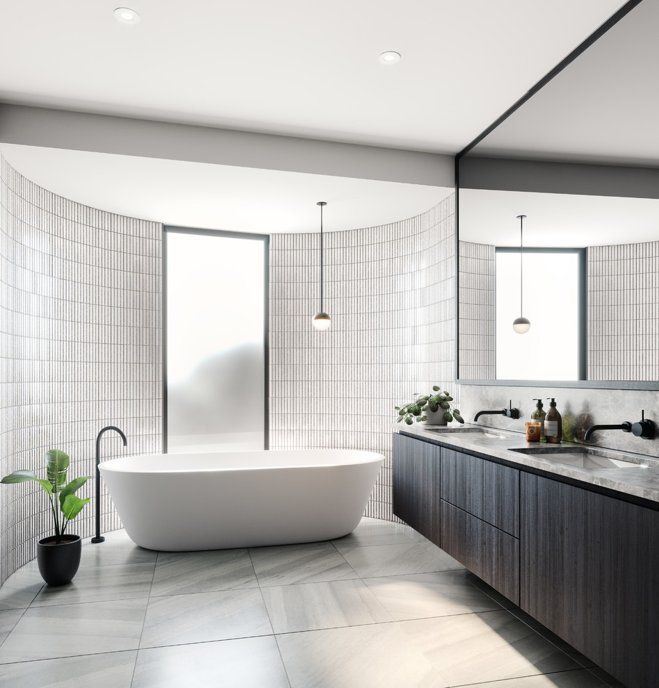 Inspiration for a mid-sized contemporary master bathroom in Melbourne with flat-panel cabinets, dark wood cabinets, a freestanding tub, an open shower, a two-piece toilet, white tile, mosaic tile, white walls, porcelain floors, an undermount sink, marble benchtops, grey floor, an open shower and grey benchtops.