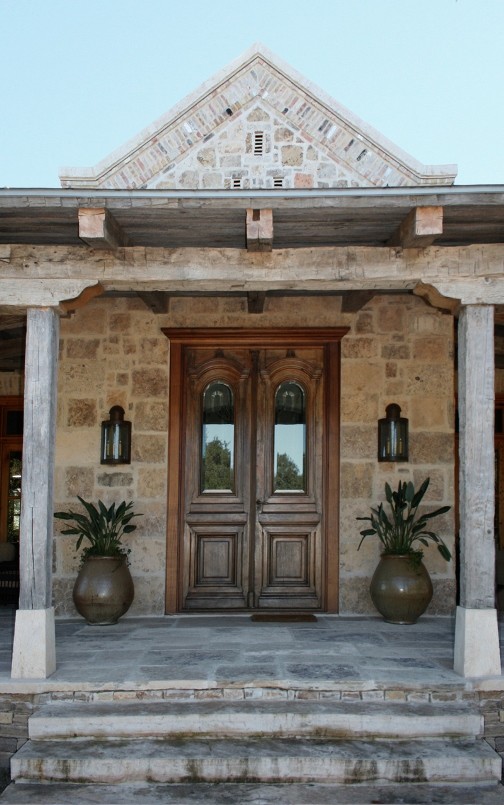 Inspiration for a country front door in Austin with a double front door and a medium wood front door.