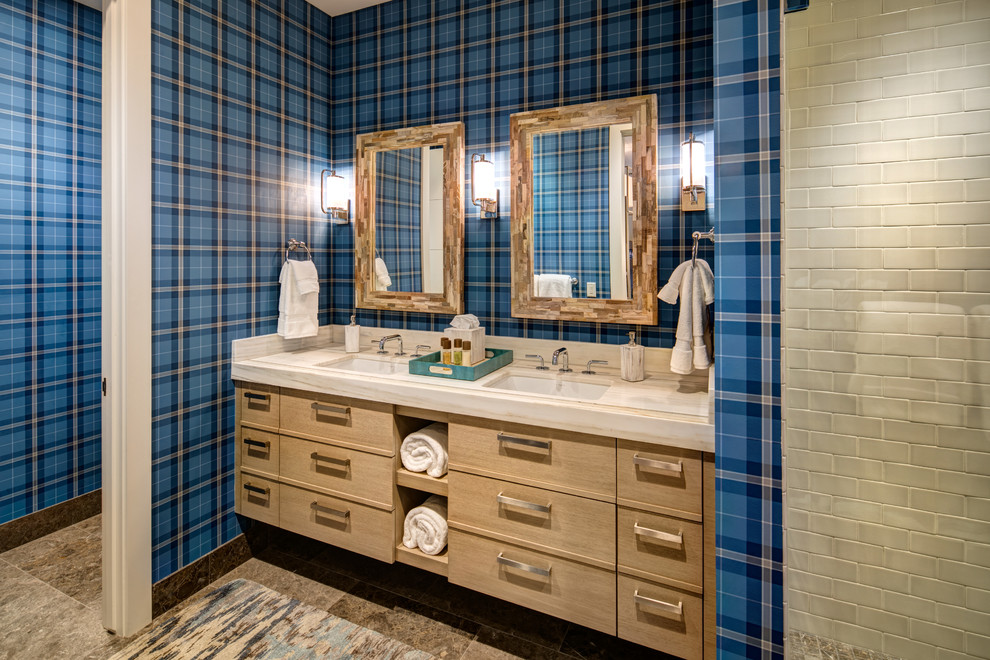 Photo of an expansive contemporary bathroom in Salt Lake City with flat-panel cabinets, dark wood cabinets, beige tile, subway tile, blue walls, an undermount sink and beige benchtops.