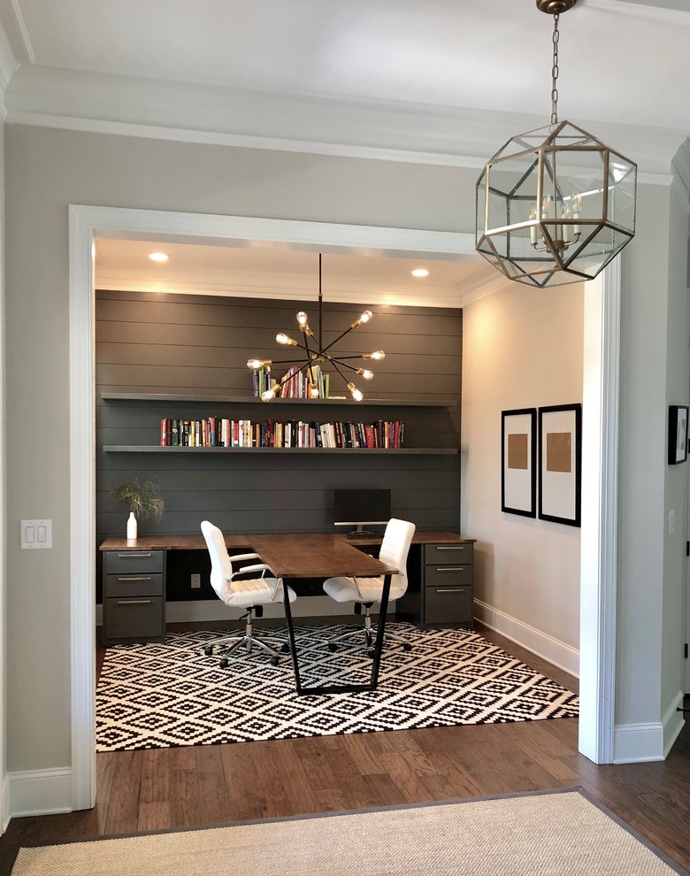 Inspiration for a mid-sized contemporary study room in Charlotte with grey walls, dark hardwood floors, a built-in desk and brown floor.