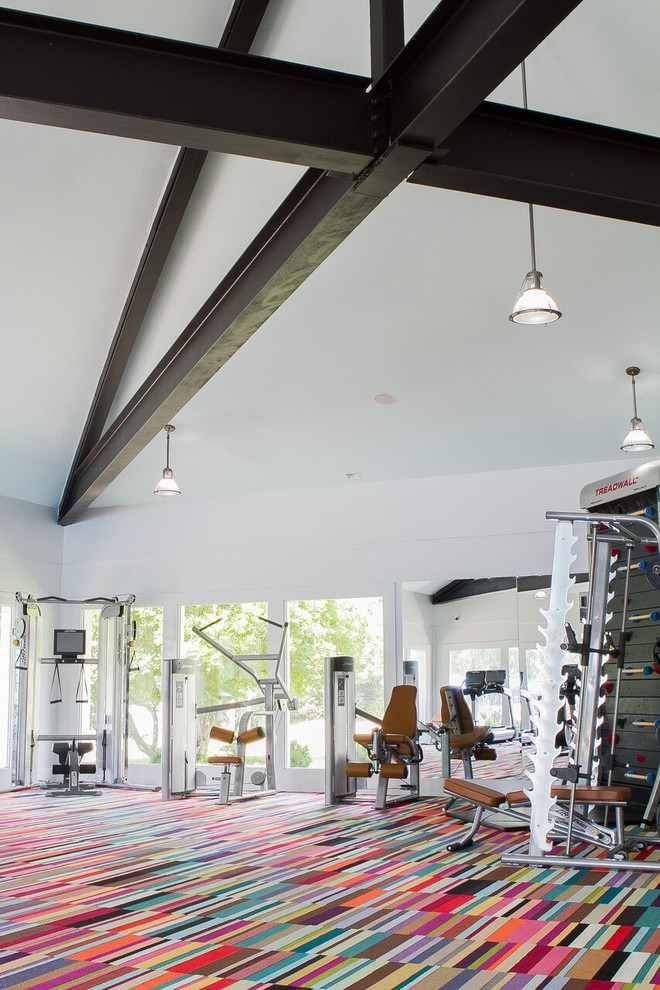 Photo of a mid-sized contemporary multipurpose gym in New York with white walls and carpet.