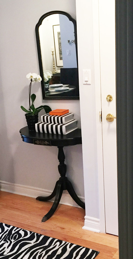 Hallway - small transitional light wood floor hallway idea in Toronto with gray walls
