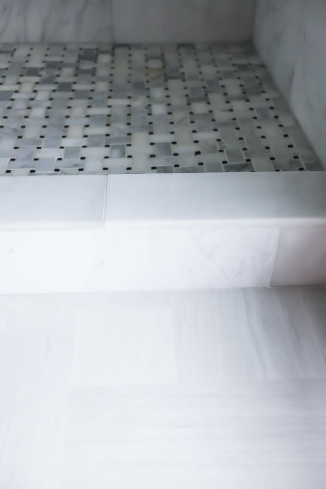 Example of a mid-sized transitional master white tile and marble tile ceramic tile and gray floor alcove bathtub design with gray walls, beaded inset cabinets, white cabinets, a two-piece toilet, an undermount sink, quartzite countertops and a hinged shower door