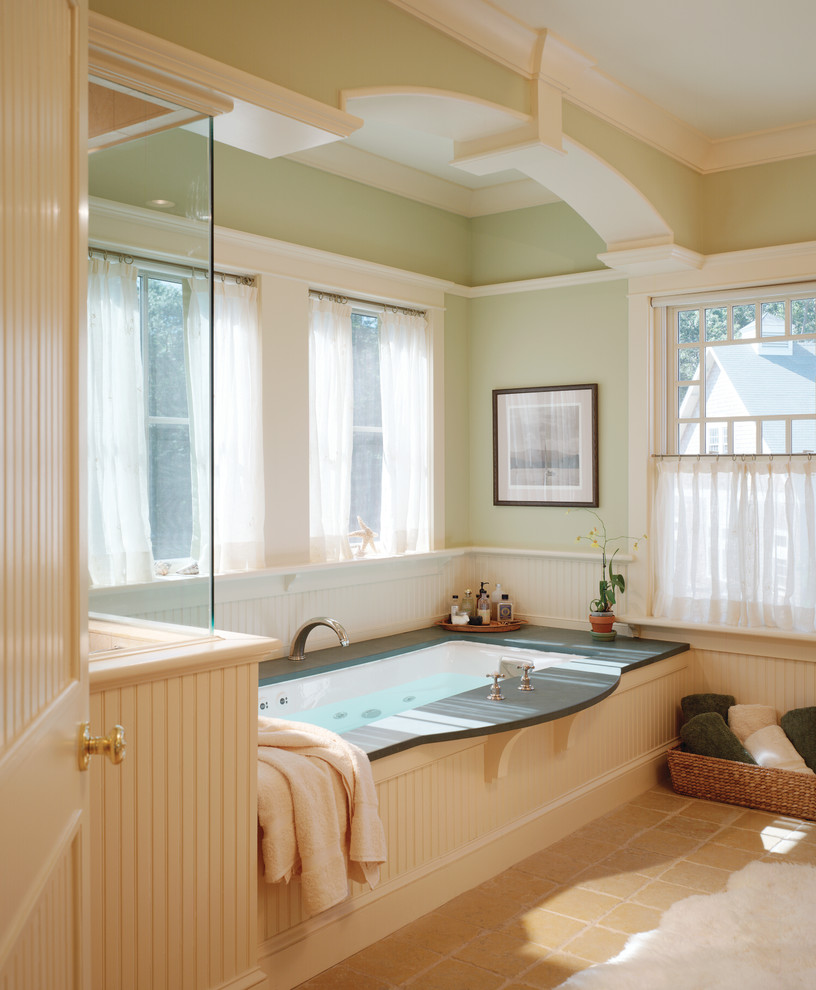 Traditional bathroom in Providence with an undermount tub.