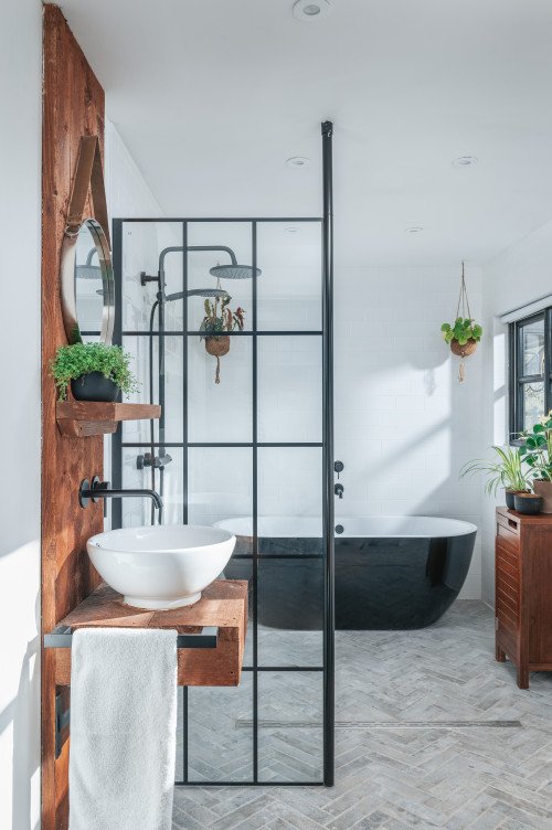 Country Chic: Wooden Vanity, Vessel Sink, and Striking Black Tub