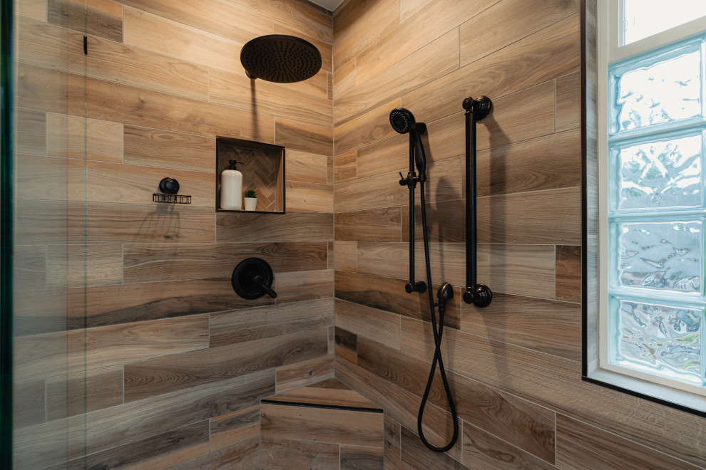 This is an example of a medium sized rustic ensuite bathroom in Seattle with shaker cabinets, brown cabinets, a freestanding bath, a built-in shower, porcelain flooring, an open shower, a wall niche, double sinks and a built in vanity unit.