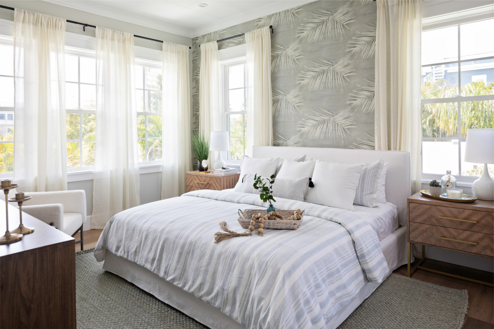 Bedroom - coastal medium tone wood floor, brown floor and wallpaper bedroom idea in Tampa with gray walls