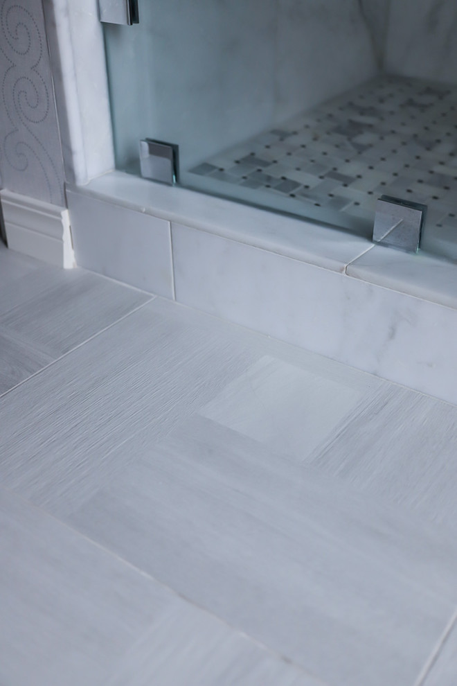 Mid-sized transitional master white tile and marble tile ceramic tile and gray floor alcove bathtub photo with gray walls, beaded inset cabinets, white cabinets, a two-piece toilet, an undermount sink, quartzite countertops and a hinged shower door