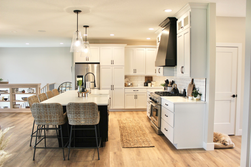 White, Black, and White Oak Open Concept Kitchen and Pantry in