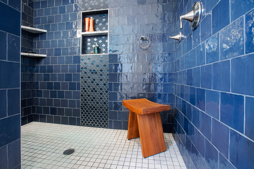Bathroom - mid-sized transitional master black tile and ceramic tile porcelain tile, gray floor and double-sink bathroom idea in Seattle with shaker cabinets, medium tone wood cabinets, an undermount sink, quartz countertops, gray countertops, a built-in vanity, a two-piece toilet, blue walls and a niche