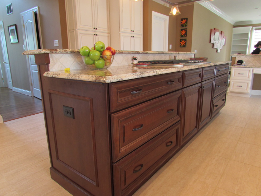 Example of a large transitional l-shaped ceramic tile eat-in kitchen design in DC Metro with raised-panel cabinets, medium tone wood cabinets, granite countertops, beige backsplash, ceramic backsplash, stainless steel appliances and an island