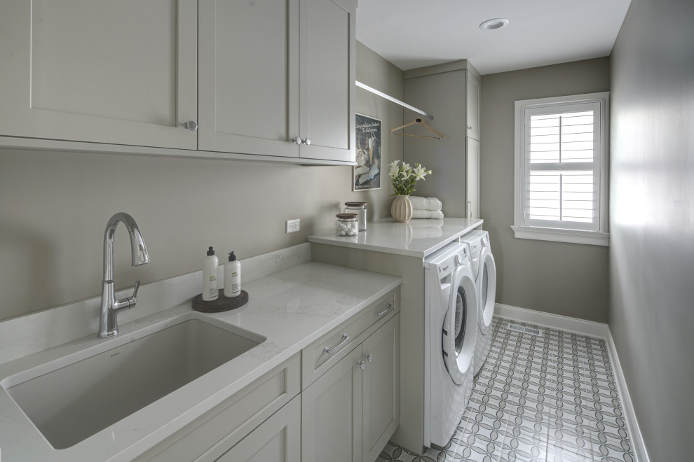 Example of a small single-wall porcelain tile laundry room design in Chicago with an undermount sink, shaker cabinets, quartz countertops and a side-by-side washer/dryer