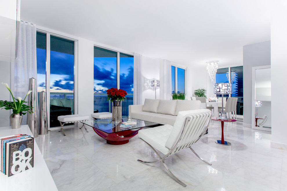 Mid-sized contemporary open concept living room in Miami with marble floors, no fireplace and multi-coloured walls.