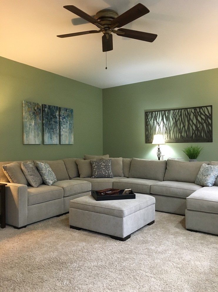 Design ideas for a large transitional formal enclosed living room in Cincinnati with green walls, carpet, a standard fireplace, a stone fireplace surround, no tv and beige floor.