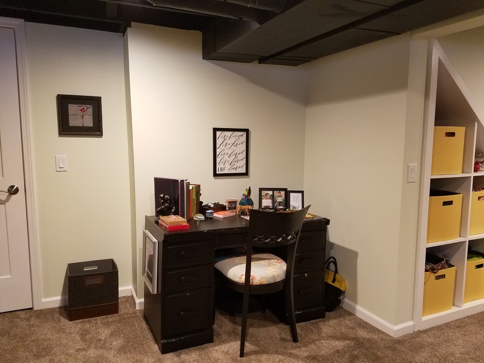Small transitional fully buried basement in Other with carpet.