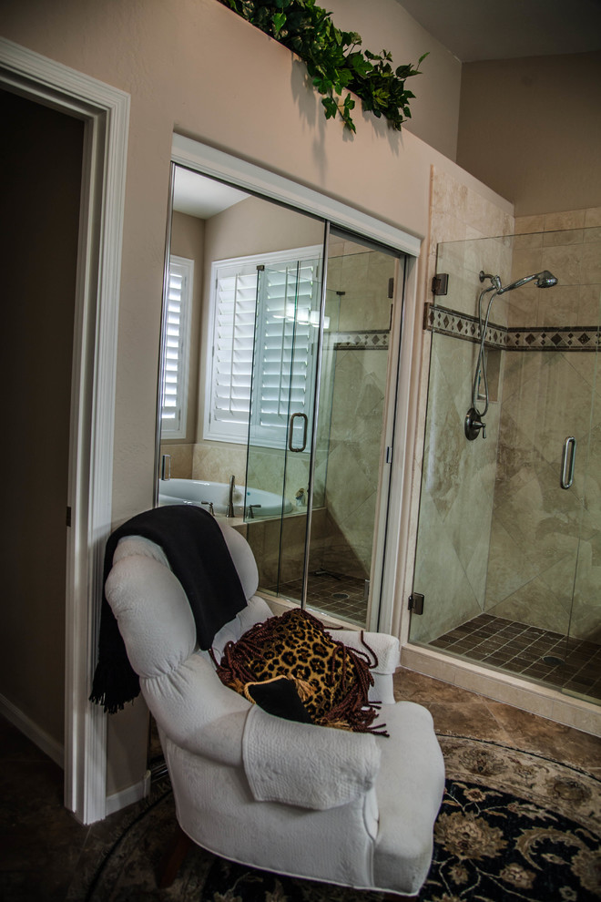 Drop-in bathtub - large transitional master ceramic tile drop-in bathtub idea in Phoenix with raised-panel cabinets, light wood cabinets, beige walls, an undermount sink and granite countertops