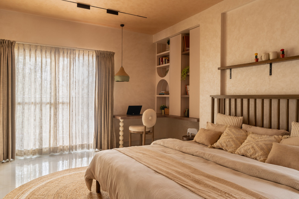 Photo of a contemporary bedroom in Bengaluru With Beige Walls.