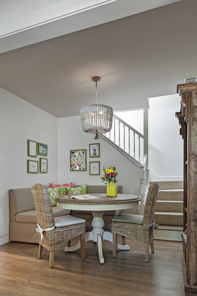 Mid-sized transitional dining room in Houston with white walls, medium hardwood floors and beige floor.