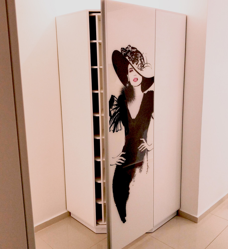 Inspiration for a large modern dressing room in Tel Aviv with glass-front cabinets.