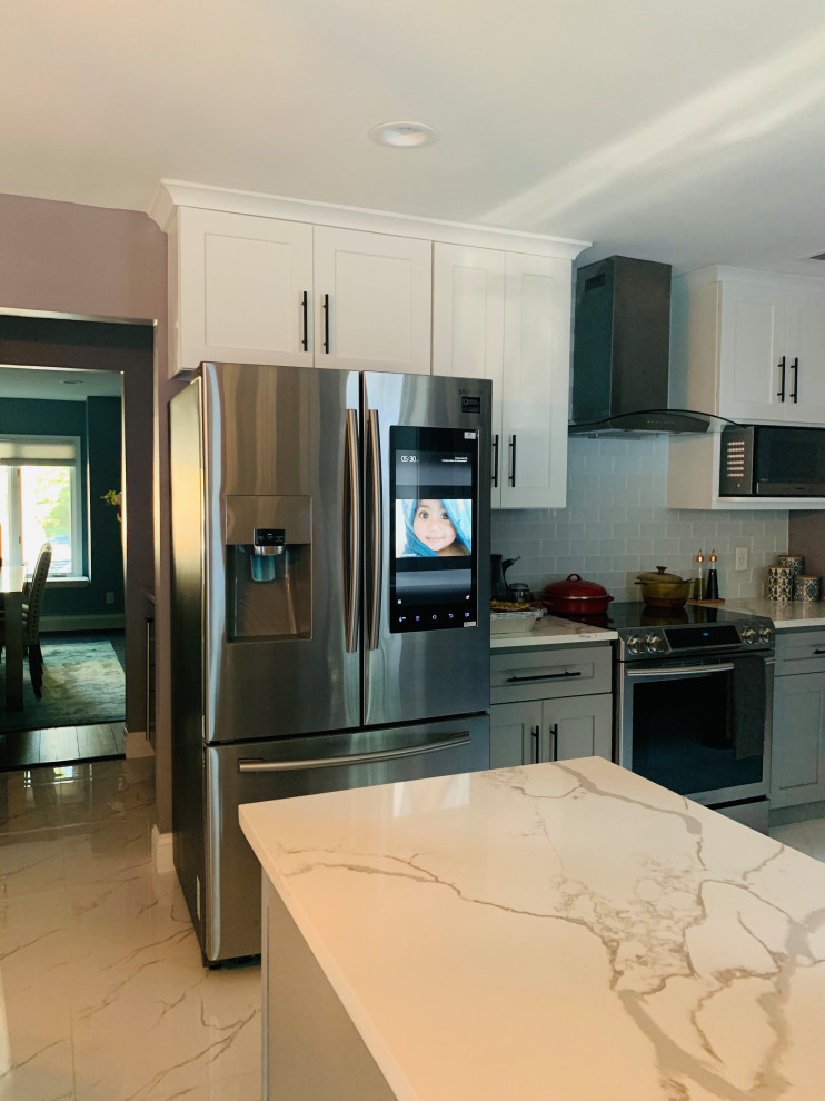 Inspiration for a mid-sized transitional l-shaped marble floor and white floor eat-in kitchen remodel in New York with glass-front cabinets, white cabinets, marble countertops, gray backsplash, glass tile backsplash, stainless steel appliances, an island and white countertops