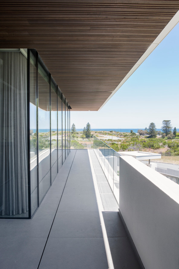 Inspiration for a contemporary balcony in Perth with a roof extension.