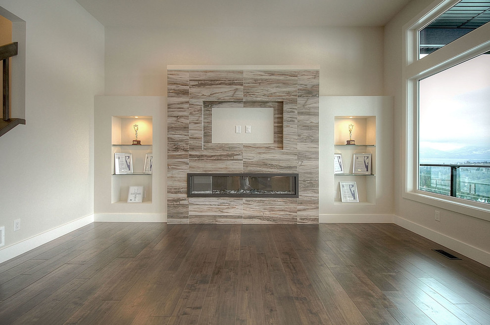 Inspiration for a mid-sized modern open concept living room in Vancouver with grey walls, vinyl floors, a ribbon fireplace, a tile fireplace surround and a wall-mounted tv.