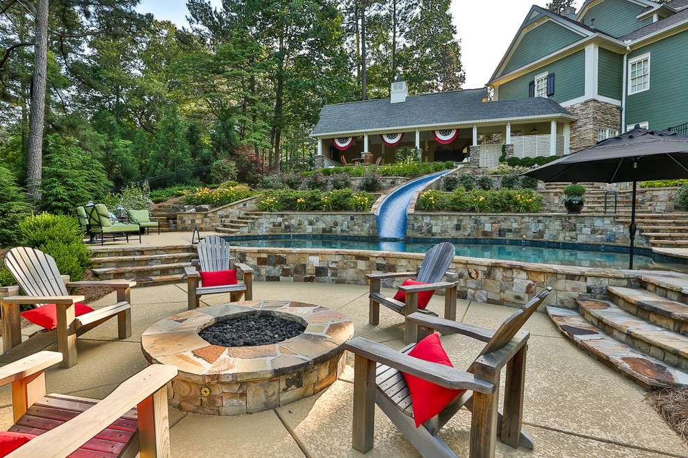 Inspiration for a large traditional backyard patio in Atlanta with a fire feature and no cover.