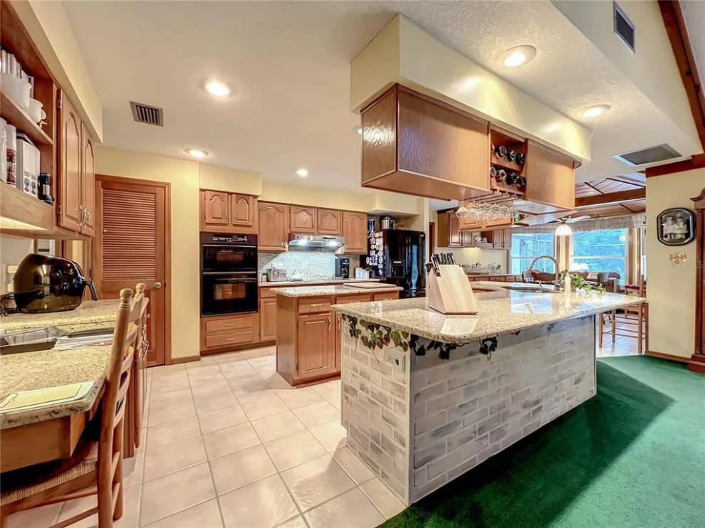 LVP Flooring with Honey Oak Kitchen