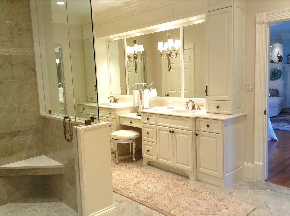 Inspiration for a mid-sized transitional master bathroom in Nashville with raised-panel cabinets, white cabinets, a corner tub, a corner shower, a two-piece toilet, beige tile, porcelain tile, beige walls, porcelain floors, an undermount sink and marble benchtops.