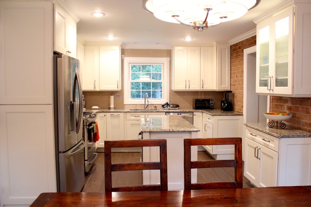 Mid-sized transitional u-shaped porcelain tile and brown floor eat-in kitchen photo in DC Metro with an undermount sink, recessed-panel cabinets, white cabinets, granite countertops, beige backsplash, porcelain backsplash, stainless steel appliances and an island