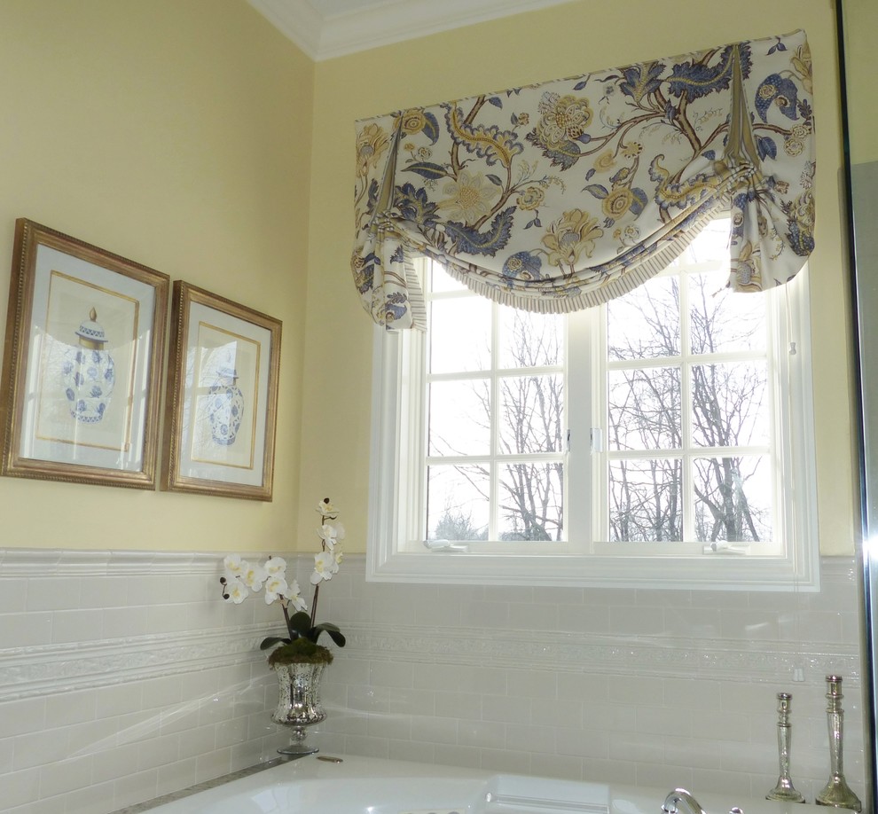Large traditional master bathroom in Columbus with an undermount sink, beaded inset cabinets, beige cabinets, granite benchtops, a drop-in tub, a corner shower, a two-piece toilet, white tile, ceramic tile, yellow walls and porcelain floors.