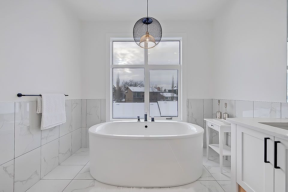 Example of a transitional home design design in Calgary